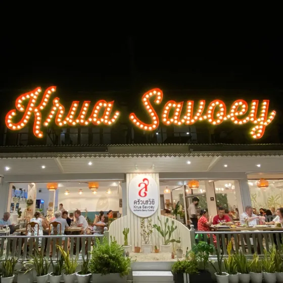 The Krua Savoey sign in lights above the restaurant