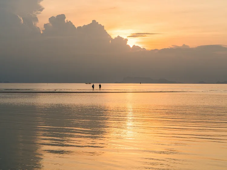 Sunset over the shallow water at Nathon Beach